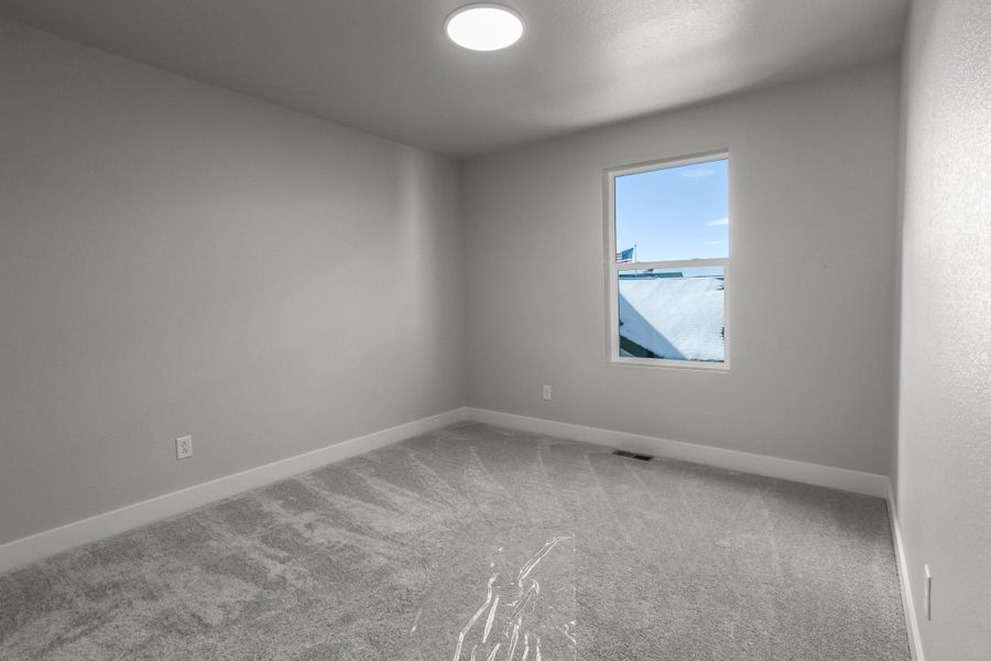 Representative unfurnished interior of a home built from the Tesla by Hartford Homes in Trailside, Timnath (Image 23).