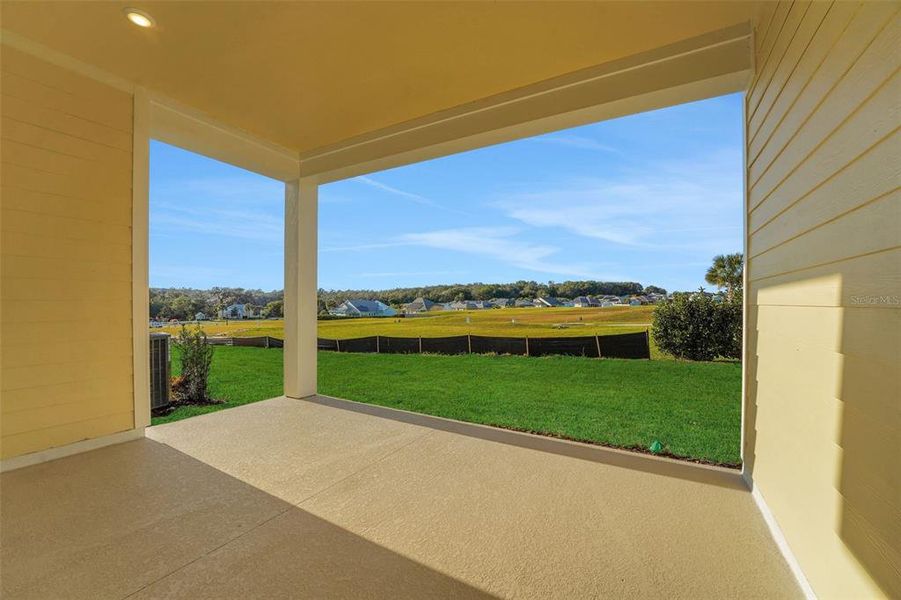 Exterior details and patio area of a home in Green Key Village, Lady Lake (Image 4).