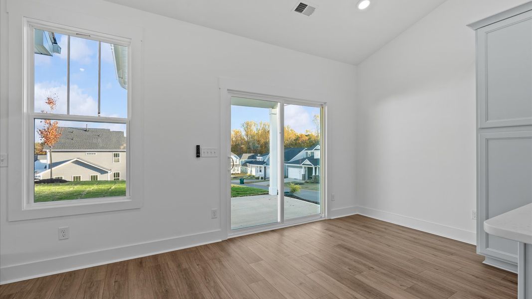 Memorable meals start in this exclusive dining area featuring elegant trim and natural light