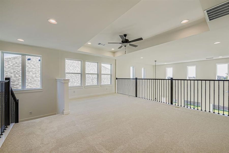 Spare room with carpet floors, a ceiling fan, and recessed lighting Spare room with carpet floors, a ceiling fan, and recessed lighting