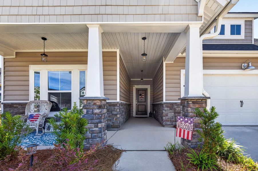 Exterior details and patio area of a home in Horizons at Summers Corner | 55+, Summerville (Image 25).