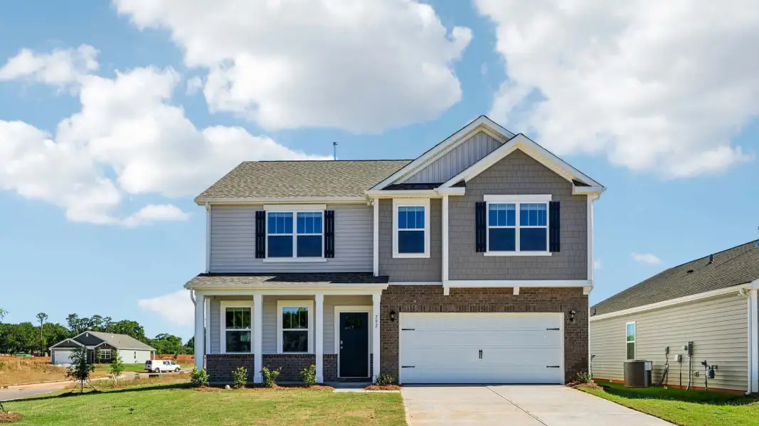 Front exterior of a new home in Wallace Springs, Statesville, NC, highlighting curb appeal (Image 1). Front exterior of a new home in Wallace Springs, Statesville, NC, highlighting curb appeal (Image 1).