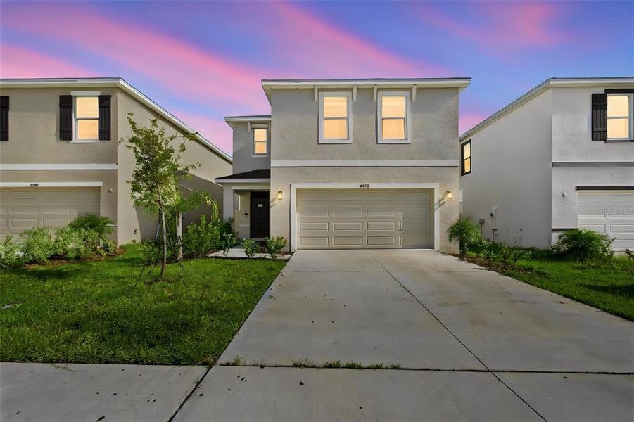 Front exterior of a new home in , Wesley Chapel, FL, highlighting curb appeal (Image 22).