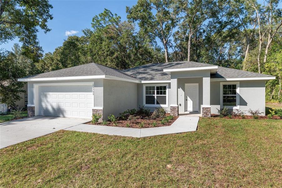 Front exterior of a new home in , Dunnellon, FL, highlighting curb appeal (Image 24). Front exterior of a new home in , Dunnellon, FL, highlighting curb appeal (Image 24).