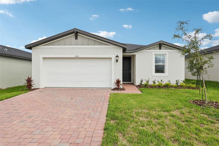 Front exterior of a new home in Hamilton Bluff - Signature Series, Lake Hamilton, FL, highlighting curb appeal (Image 19).