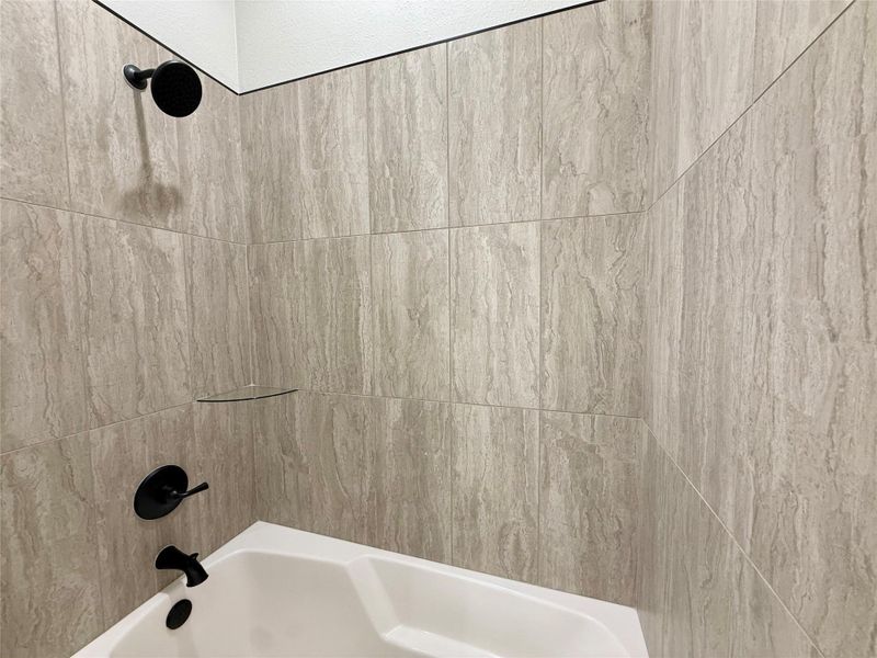 Full bathroom with shower / bathtub combination