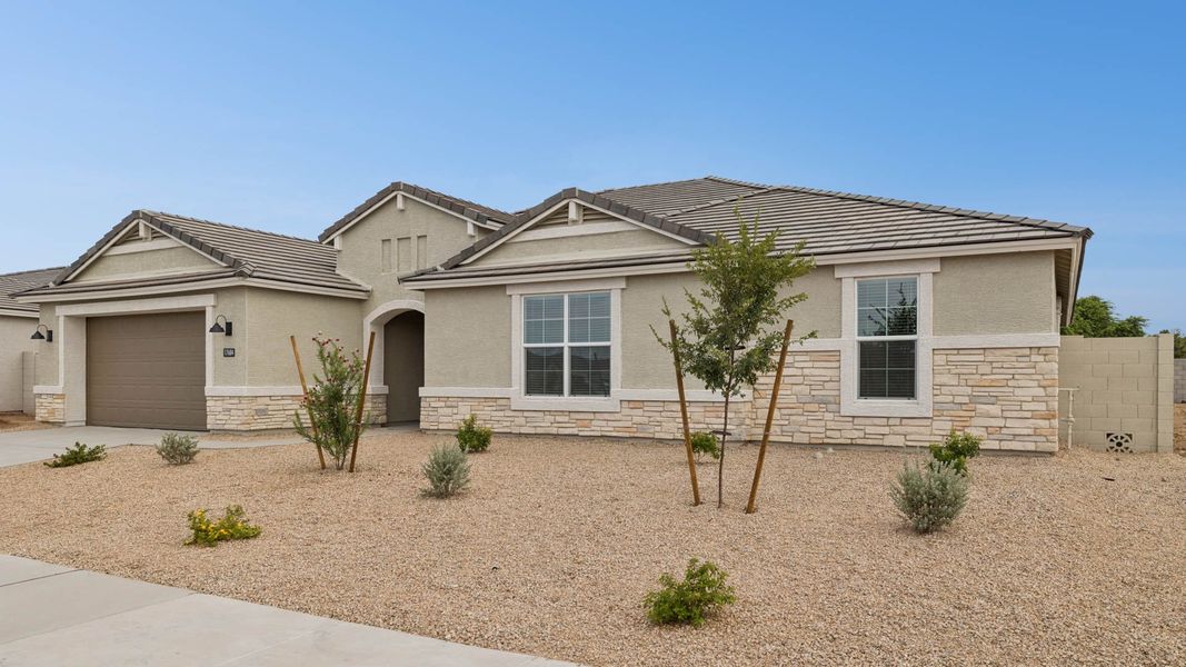 Front exterior of a new home in Zanjero Pass, Waddell, AZ, highlighting curb appeal (Image 2).