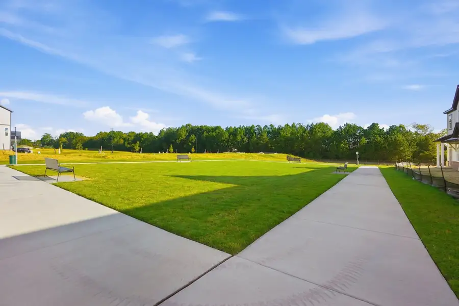 Exterior details and patio area of a home in Indian Trail Townhomes, Indian Trail (Image 3).
