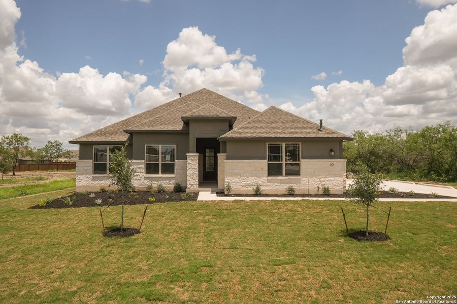 Front exterior of a new home in Everly Estates, San Antonio, TX, highlighting curb appeal (Image 19).