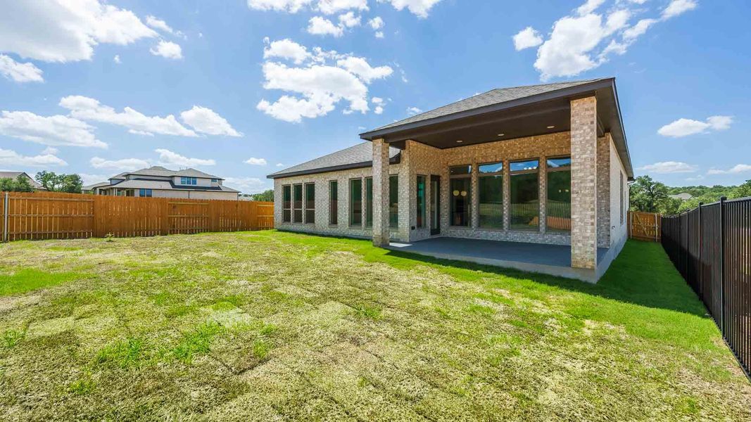Exterior details and patio area of a home in Parkside on the River West, Georgetown (Image 2).