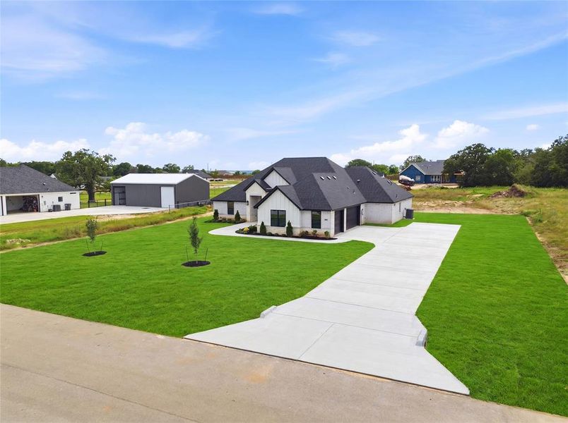 Front exterior of a new home in , Azle, TX, highlighting curb appeal (Image 2). Front exterior of a new home in , Azle, TX, highlighting curb appeal (Image 2).