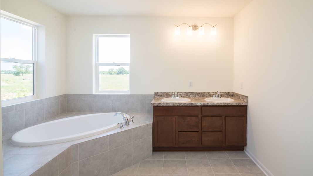 Representative furnished interior of a home built from the The Briarhaven III by Norfolk Homes in Coronado Estates, Jackson (Image 18).