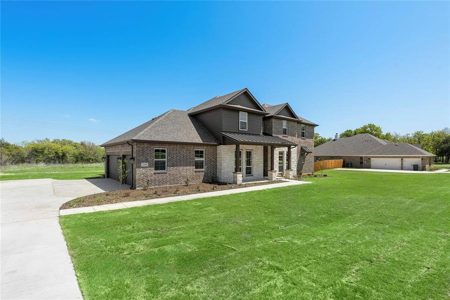 Front exterior of a new home in Crystal Springs Estates, Alvarado, TX, highlighting curb appeal (Image 25).