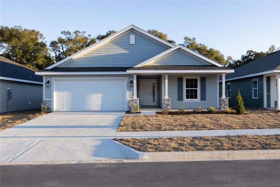 Front exterior of a new home in Kirkland Farms, Alachua, FL, highlighting curb appeal (Image 1). Front exterior of a new home in Kirkland Farms, Alachua, FL, highlighting curb appeal (Image 1).