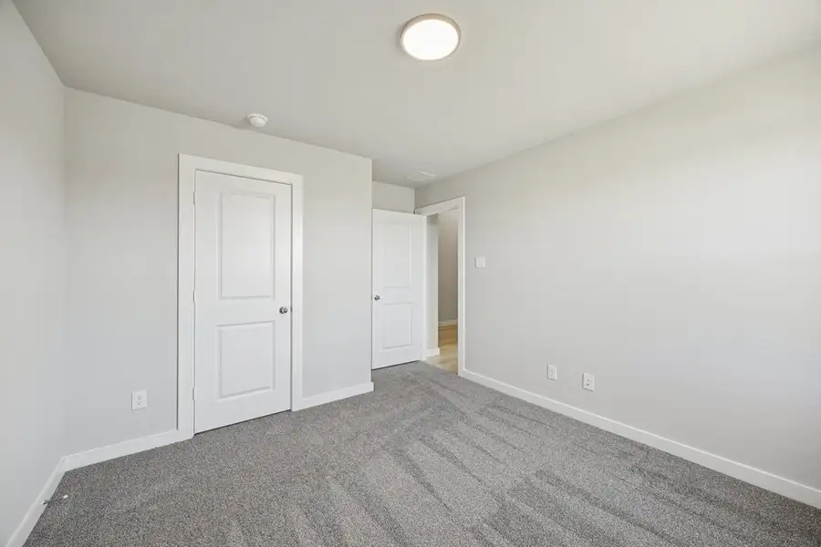 Representative unfurnished interior of a home built from the The Elm by Lillian Custom Homes in Hickory Hill, Sherman (Image 35).