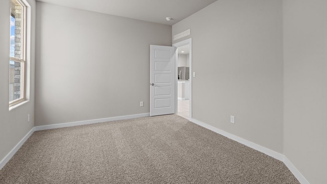 Representative unfurnished interior of a home built from the Jaxson by D.R. Horton in Legacy South, Midland (Image 23).