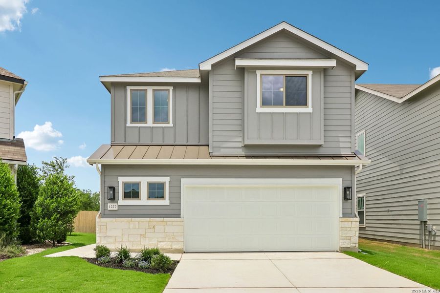 Front exterior of a new home in Casinas at Gruene, New Braunfels, TX, highlighting curb appeal (Image 1). Front exterior of a new home in Casinas at Gruene, New Braunfels, TX, highlighting curb appeal (Image 1).