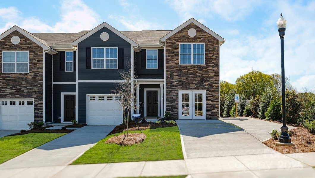 Front exterior of a new home in Fergus Crossing, York, SC, highlighting curb appeal (Image 1). Front exterior of a new home in Fergus Crossing, York, SC, highlighting curb appeal (Image 1).