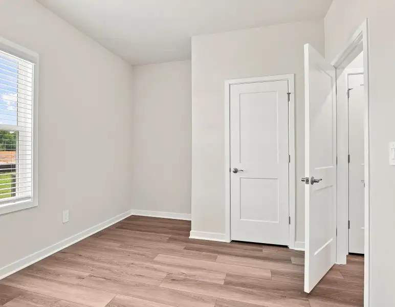 Spacious, unfurnished interior of a new home in Country Lane - Classic Series, Clayton (Image 12).