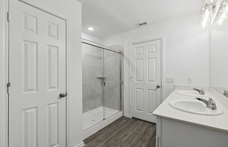 Owner's private bath with double vanity and spacio