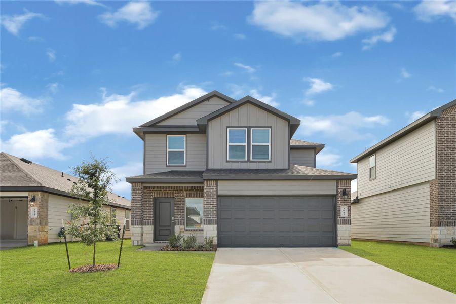 Front exterior of a new home in Tamarron, Fulshear, TX, highlighting curb appeal (Image 1). Front exterior of a new home in Tamarron, Fulshear, TX, highlighting curb appeal (Image 1).
