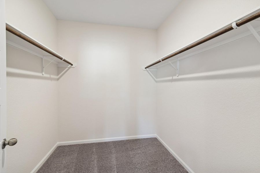 The Crawford- Primary Suite Walk-In Closet. Sample image for illustration; upgrades, options, and colors may vary. The Crawford- Primary Suite Walk-In Closet. Sample image for illustration; upgrades, options, and colors may vary.