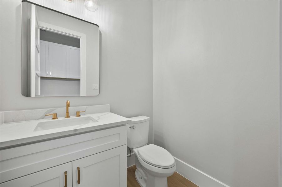 Bathroom with toilet and vanity