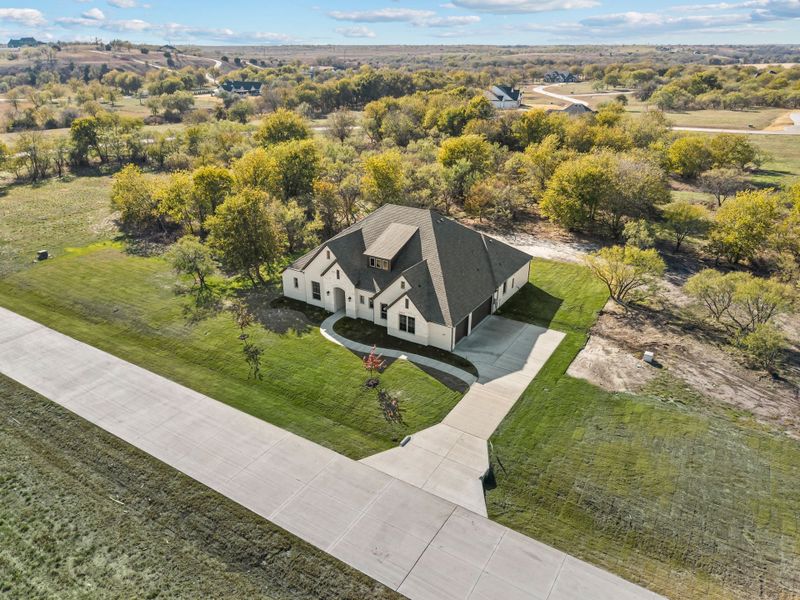 Front exterior of a new home in Rolling Creek Ranch, Aledo, TX, highlighting curb appeal (Image 28).
