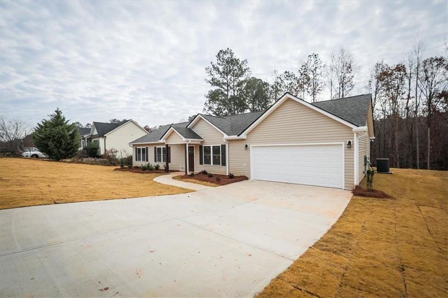 Front exterior of a new home in , Rockmart, GA, highlighting curb appeal (Image 1).