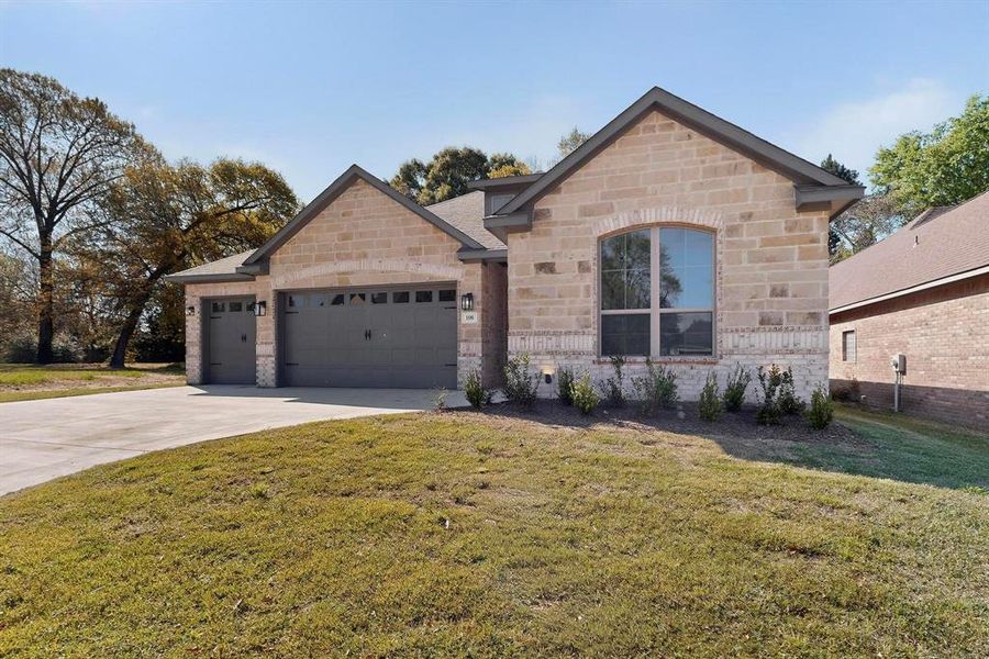 Front exterior of a new home in , Athens, TX, highlighting curb appeal (Image 26).