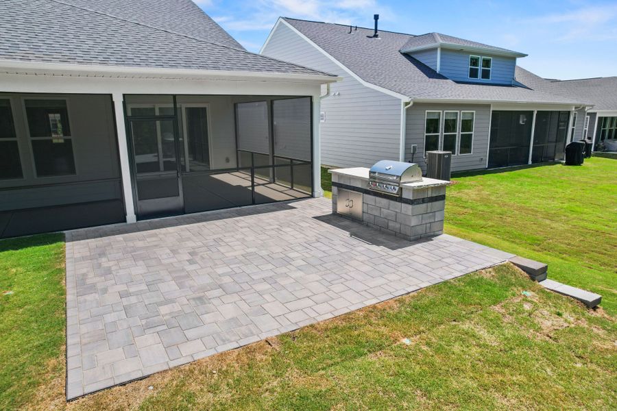 Exterior details and patio area of a home in Carolina Riverside, Belmont (Image 34).