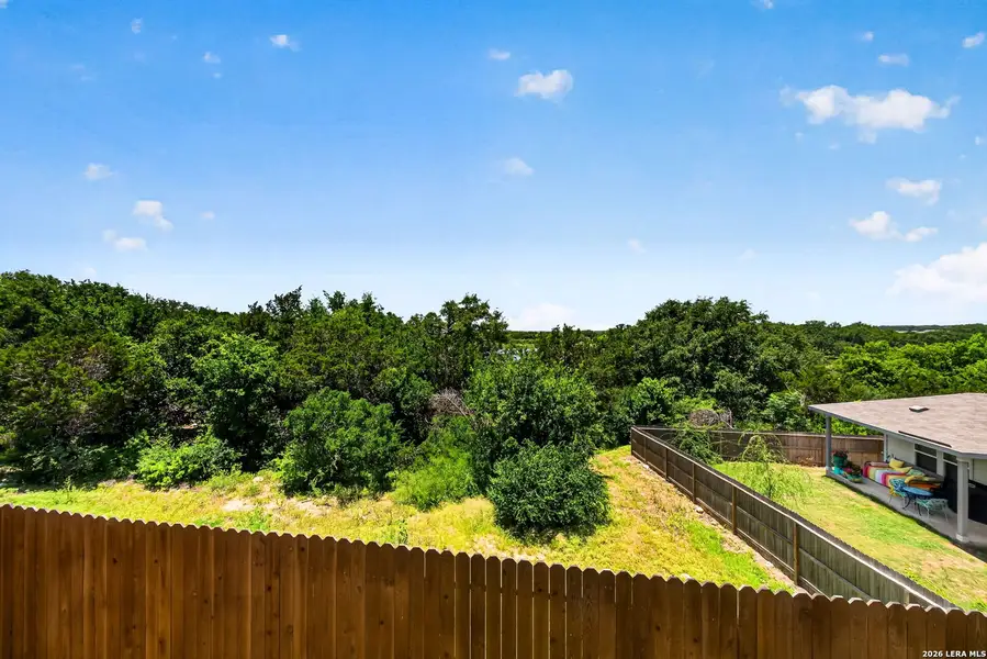 Exterior details and patio area of a home in Thomas Pond, San Antonio (Image 4).