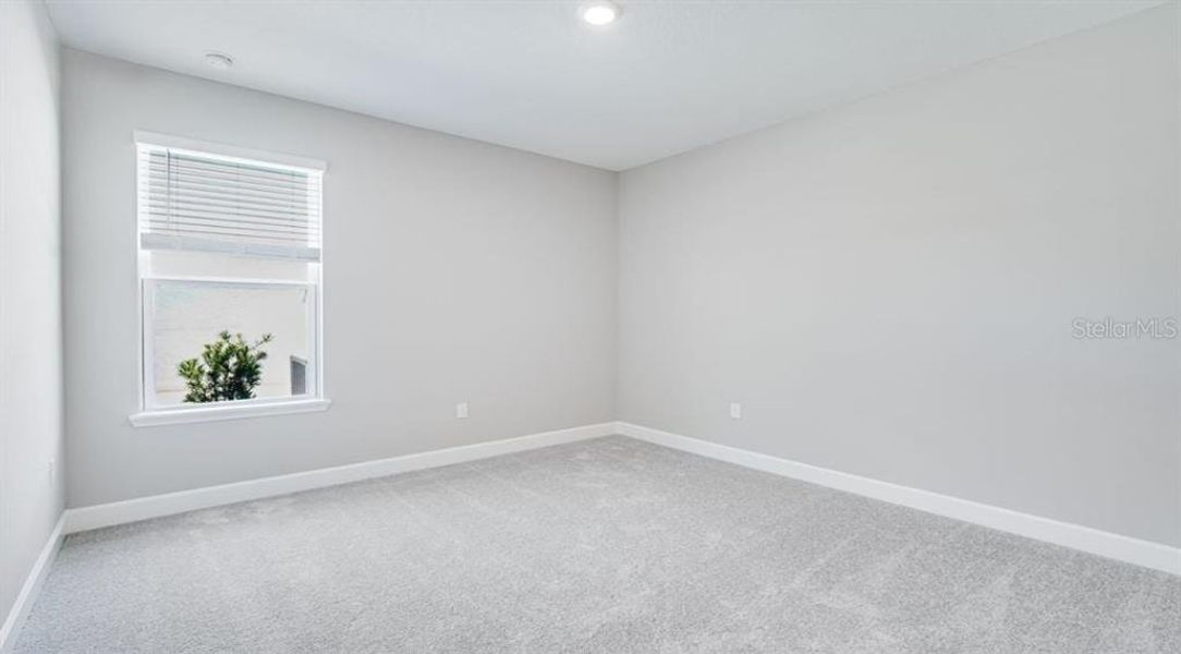 Spacious, unfurnished interior of a new home in The Cove at West Port, Port Charlotte (Image 16).