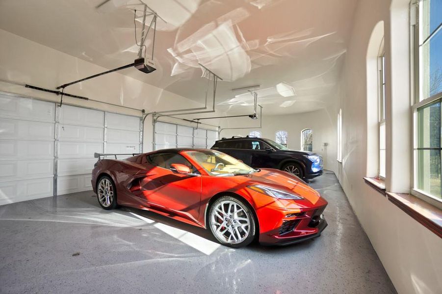 Garage featuring a garage door opener