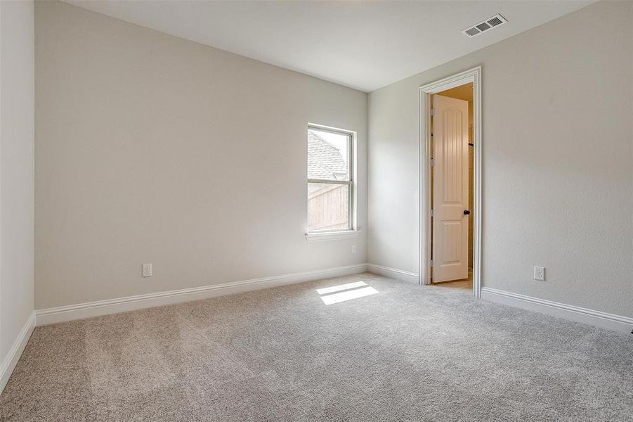 Spare room with light carpet