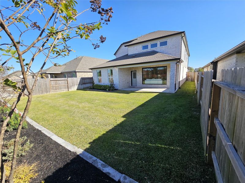 Exterior details and patio area of a home in Sunterra, Katy (Image 2). Exterior details and patio area of a home in Sunterra, Katy (Image 2).