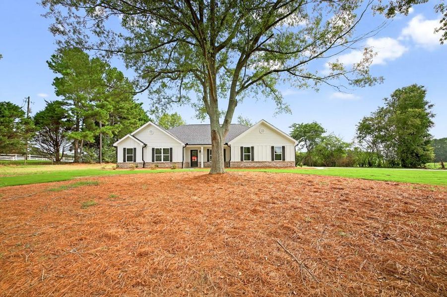 Front exterior of a new home in , Statham, GA, highlighting curb appeal (Image 21).