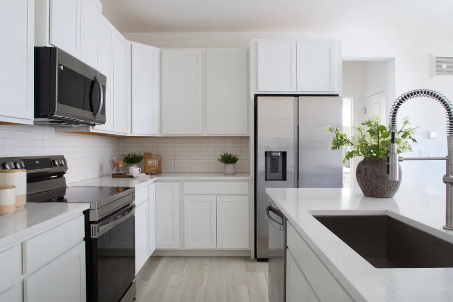 Furnished interior view inside a new home in Lyric at RidgeGate Condos, Lone Tree (Image 7).
