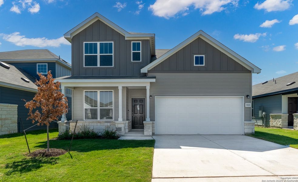 Front exterior of a new home in Vista Real, Converse, TX, highlighting curb appeal (Image 1).