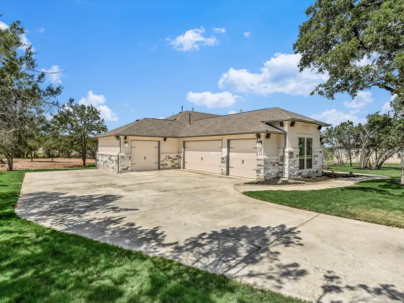 Representative exterior photo of a completed home built from the Santa Monica by Giddens Homes in Clearwater Ranch, Liberty Hill, TX (Image 28). Representative exterior photo of a completed home built from the Santa Monica by Giddens Homes in Clearwater Ranch, Liberty Hill, TX (Image 28).