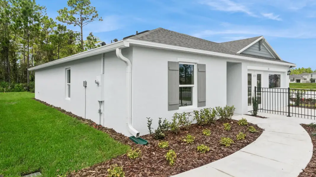Representative exterior photo of a completed home built from the Fletcher by D.R. Horton in Sunside at Ormond Station, Ormond Beach, FL (Image 19).