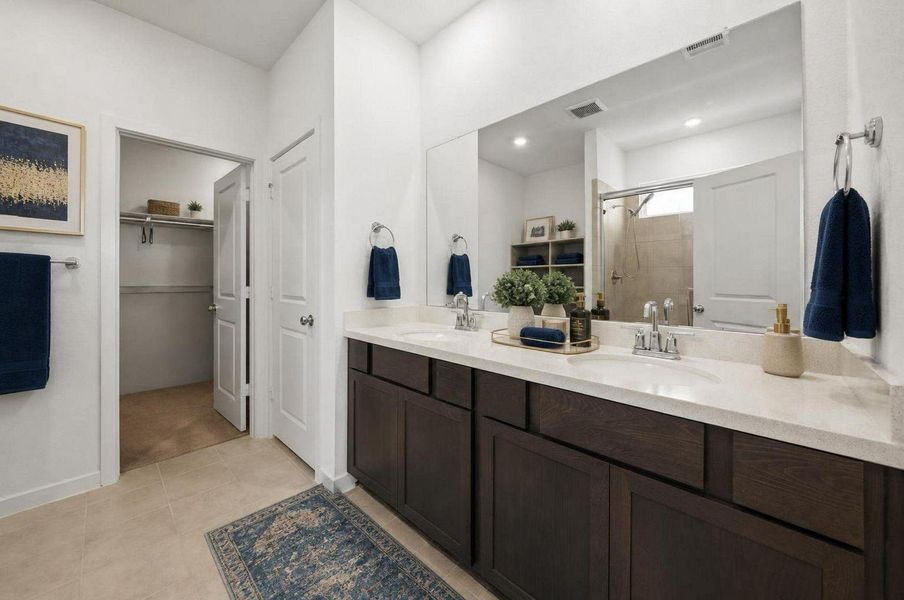 The primary bathroom features double sinks, a long vanity, and clean modern finishes. The layout keeps the suite functional while maintaining a bright, polished look.Virtually staged. The primary bathroom features double sinks, a long vanity, and clean modern finishes. The layout keeps the suite functional while maintaining a bright, polished look.Virtually staged.