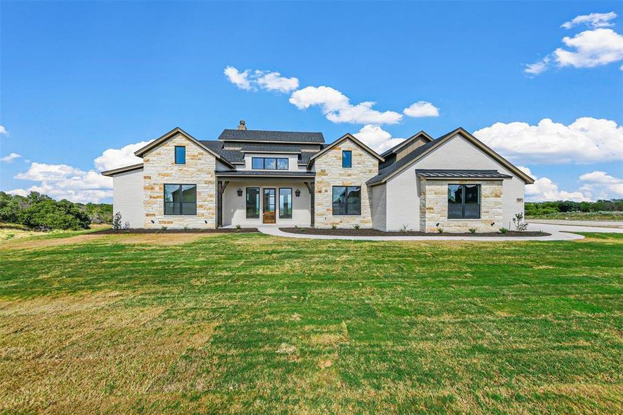 View of front of house with a front yard