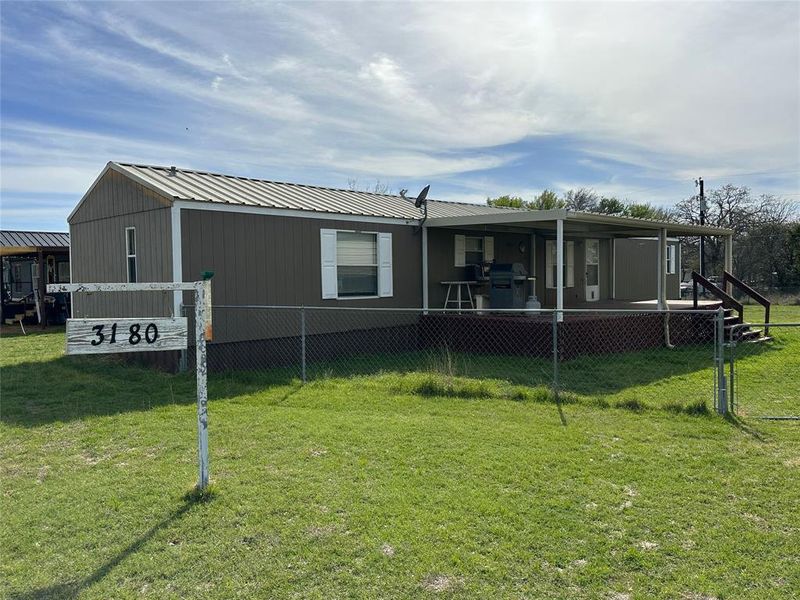 Exterior details and patio area of a home in , May (Image 15).