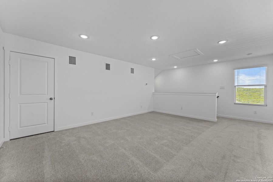 Spacious, unfurnished interior of a new home in Waterwheel: Coastline Collection, San Antonio (Image 18).