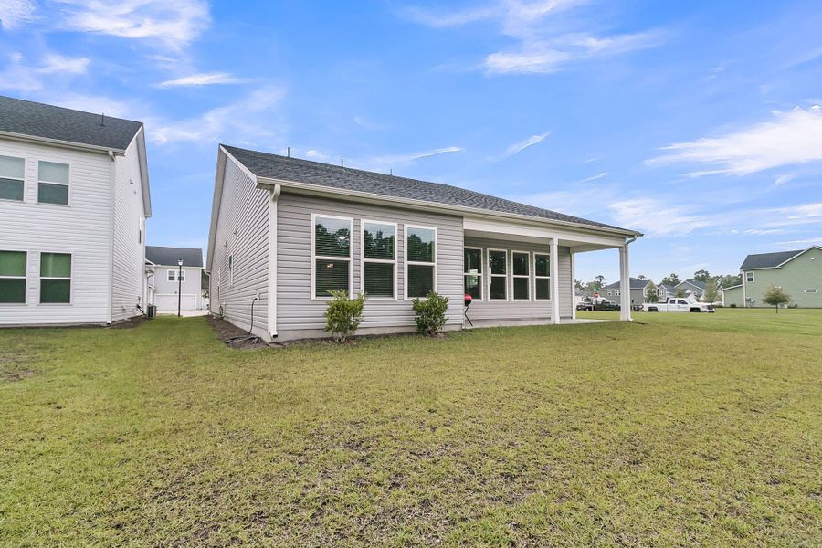 Front exterior of a new home in The Groves of Berkeley, Moncks Corner, SC, highlighting curb appeal (Image 26).