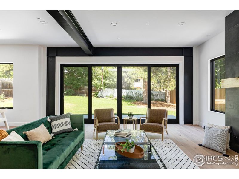 Relax alongside a handsome linear gas fireplace and exposed structural steel beams in the expansive great room.