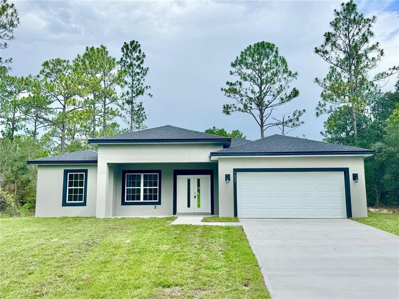Front exterior of a new home in , Citrus Springs, FL, highlighting curb appeal (Image 19).