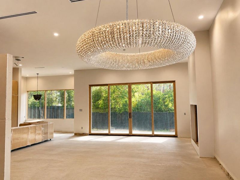 Another view of incomplete living area with lighting features.
