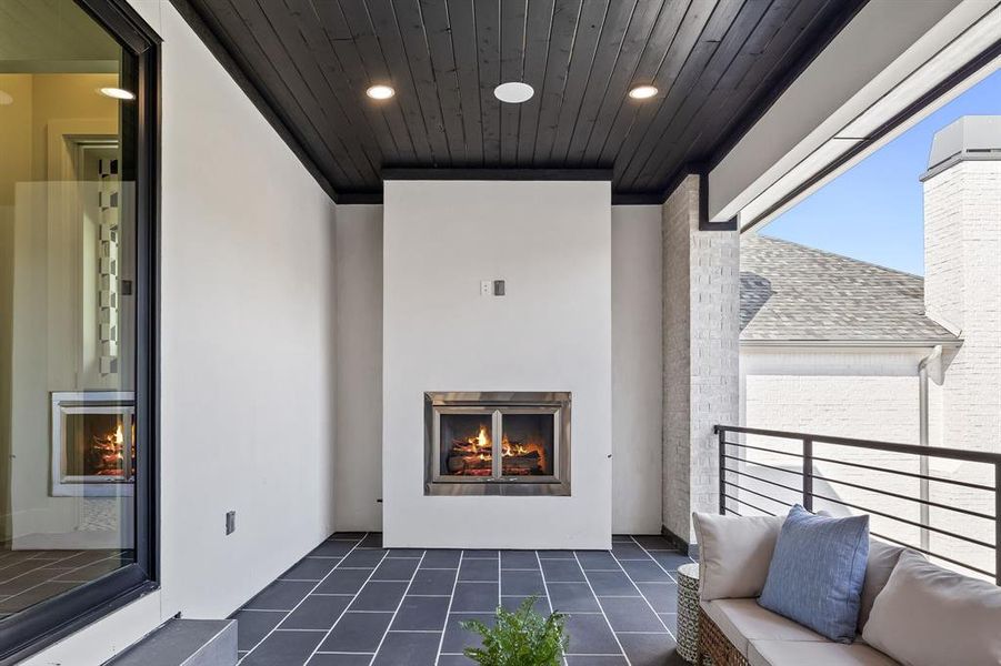 Balcony with a warm lit fireplace Balcony with a warm lit fireplace